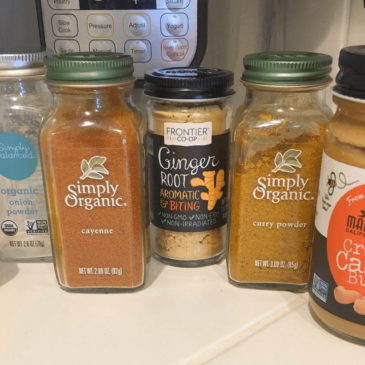 Jars of peanut butter and lemon juice on a kitchen counter, promoting Real Food.