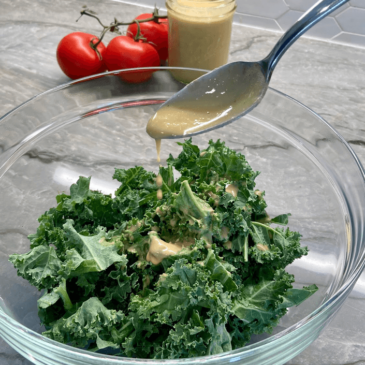 A Real Food salad bowl filled with kale, prepared by a Certified Nutrition Consultant.