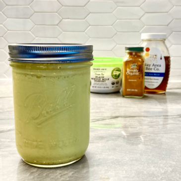 A mason jar filled with locally sourced honey, expertly curated by a Certified Nutrition Consultant.