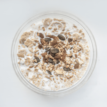 A bowl of granola on a white background, complementing its role as real food.